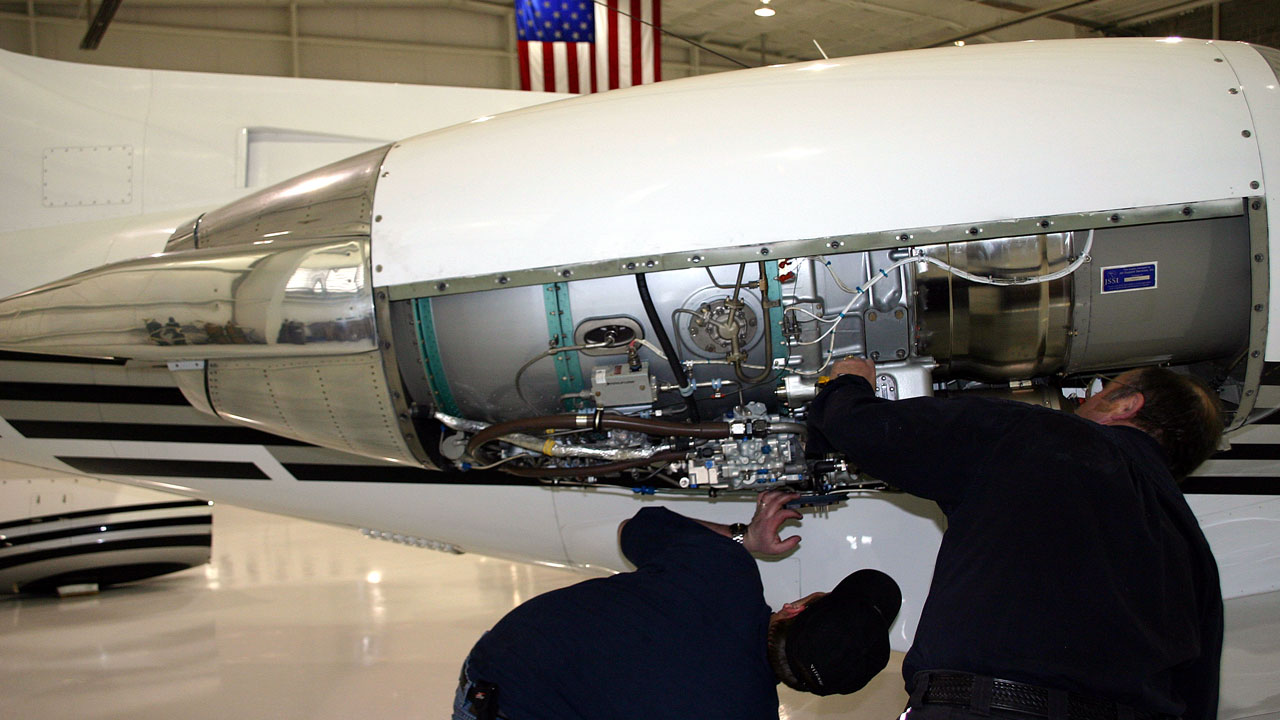 business aviation maintenance staff working on citation jet