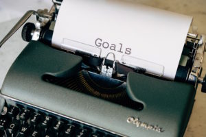 strategic goal setting - goals written on typewriter