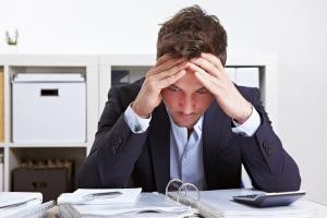 Business man in office with burnout syndrome
