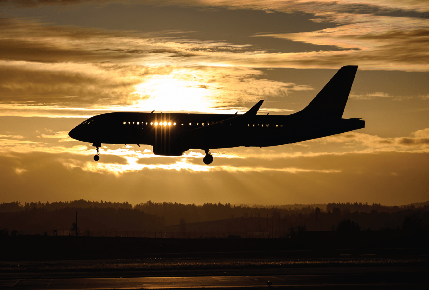 commercial aircraft in sunset - corporate aviation vs airline pilot jobs