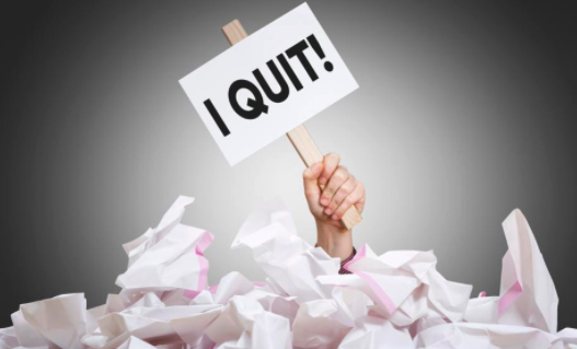 woman holding sign "i quit" - great upgrade