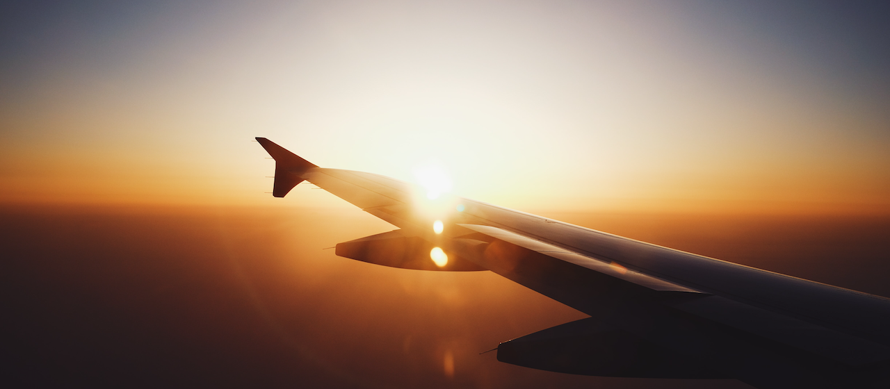 ainsight-sheryl-barden-making-hay-contracting-unsplash jet wing flying in sky sunrise - making hay as a contractor while the sun shines