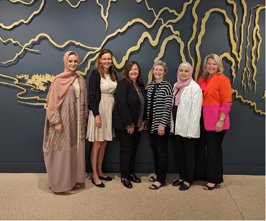 Diverse group of six women in IWF Fellows Program wearing business attire facing camera, including Jennifer Pickerel