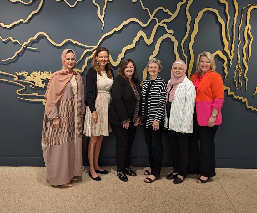 Diverse group of six women in  IWF Fellows Program wearing business attire facing camera, including Jennifer Pickerel