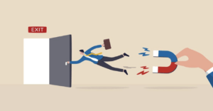 business man being pulled by a magnet so he doesn't leave exit door - Adobestock image - symbolizing employer retention issues