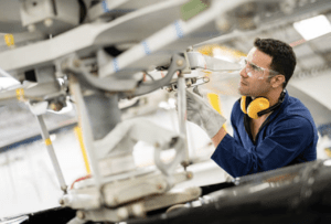 inspection authorization in business aviation maintenance - image of maintenance tech working on business jet