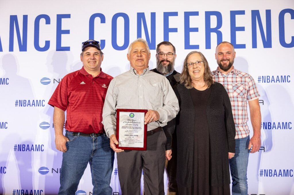 James Popik and family receives Charles Taylor award for master mechanic