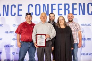 James Popik and family receives Charles Taylor award for master mechanic