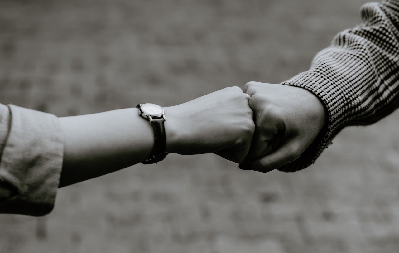 fist bump with two hands - restoring civility in the workplace