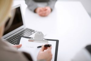 business aviation recruiter taking notes during interview