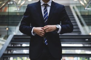 job interview candidate talent shortage man buttoning suit