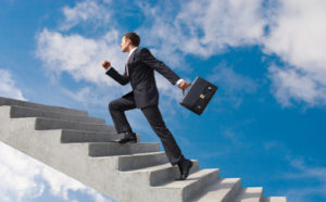 businessman climbing ladder -