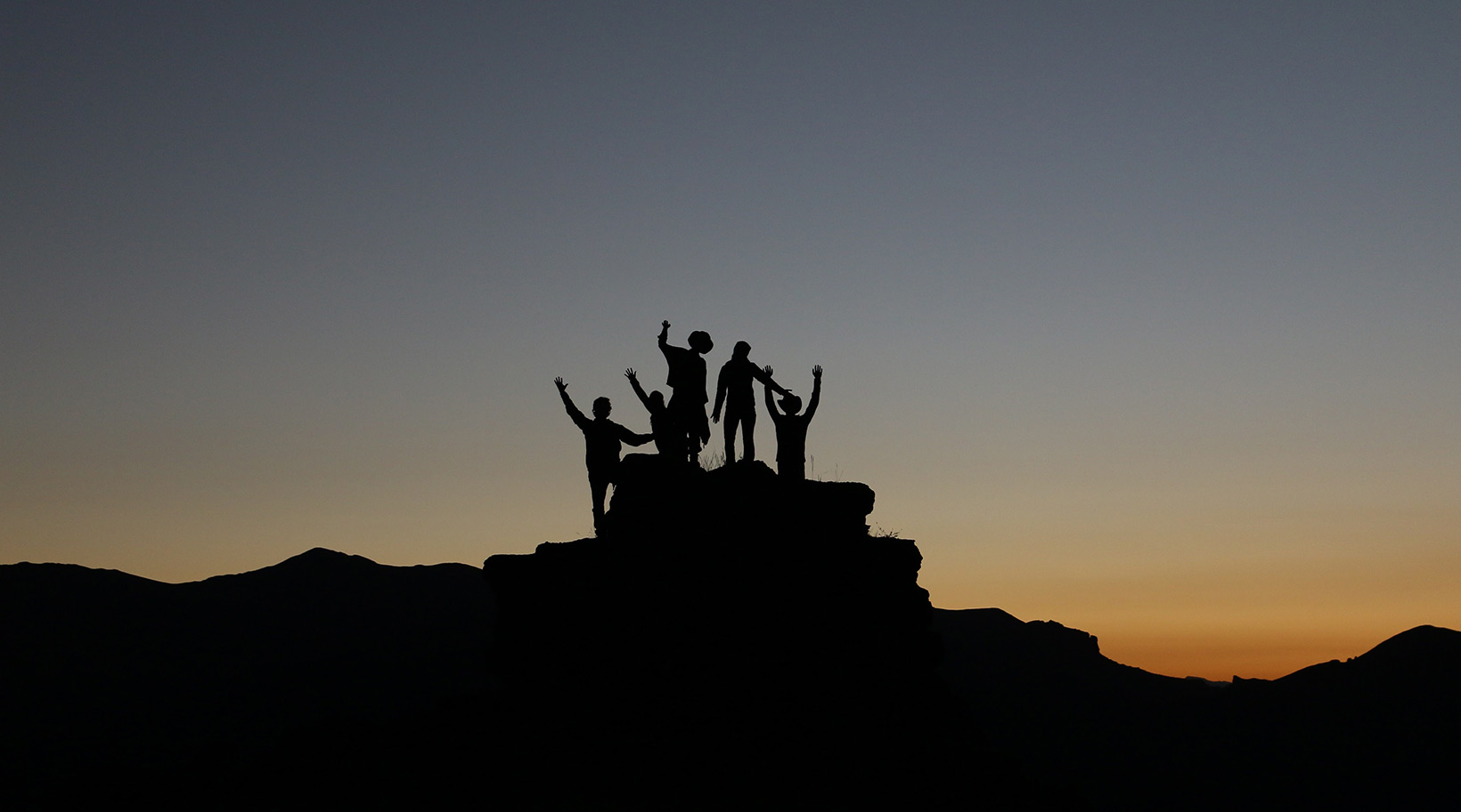 develop aviation professionals - team celebrating on mountaintop