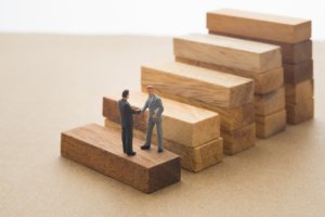 planning for your successor - two men on blocks - succession planning