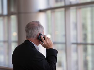 what you say counts - pic of a man talking on cell phone - unsplash